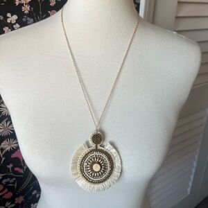 White/cream and gold statement necklace.